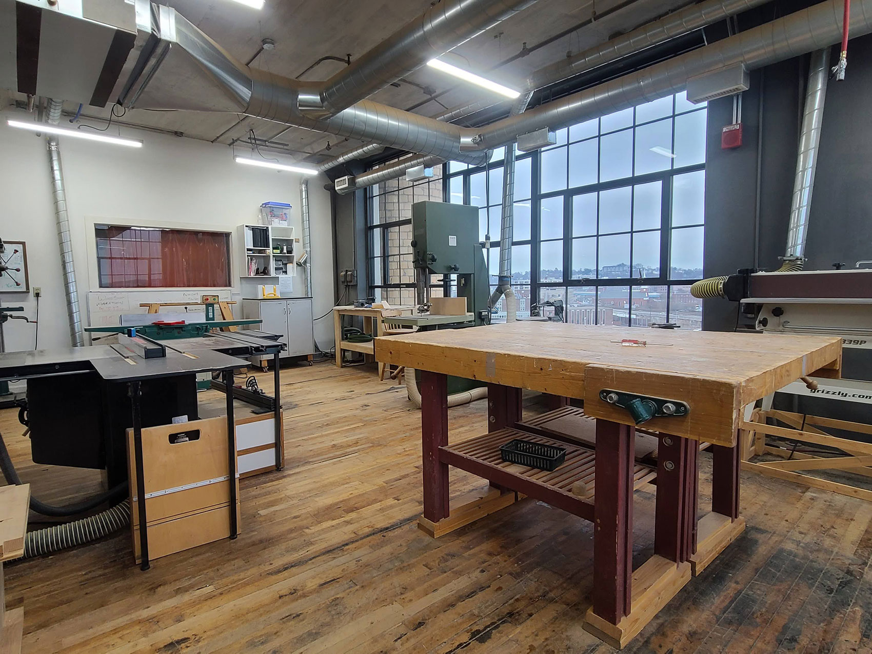 The Technocopia Wood Shop's tool set includes a joiner, a band saw, a table saw, a belt sander, and more.