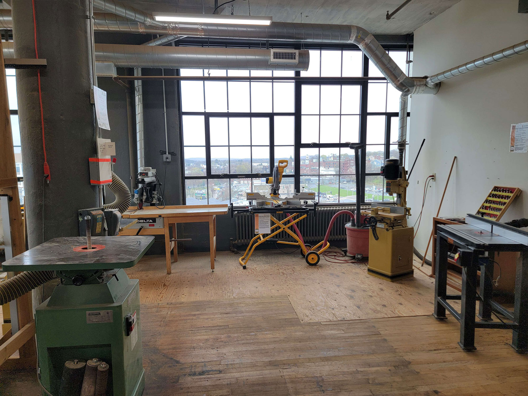 The Technocopia Wood Shop's tool set includes an oscillating spindle sander, a table router, a radial arm saw, a hollow chisel mortiser, a compound sliding miter saw and more.